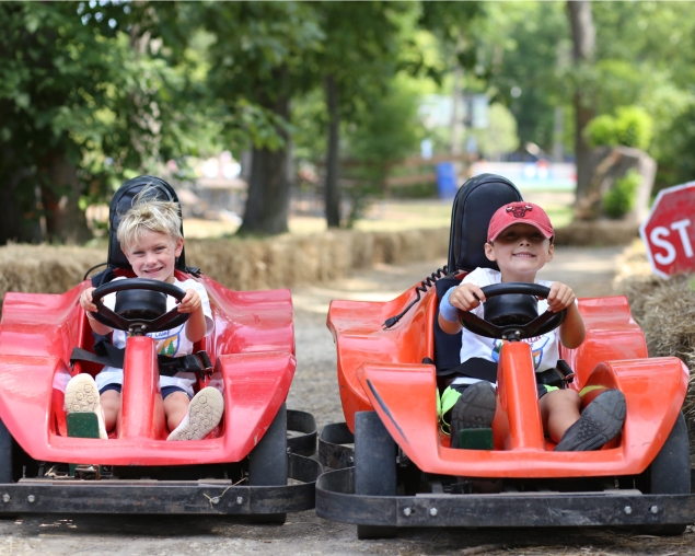 Campers driving go-karts