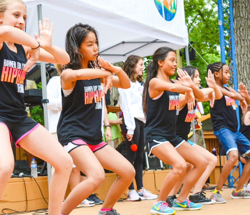 Group of girl campers dancing on stage