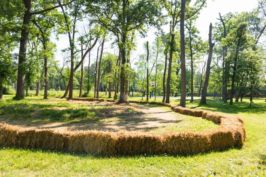 The go kart track surrounded by hay bales