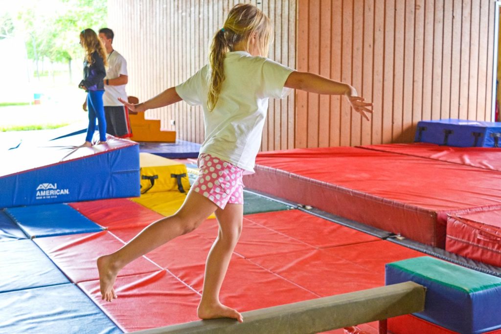 A girl on a balance beam