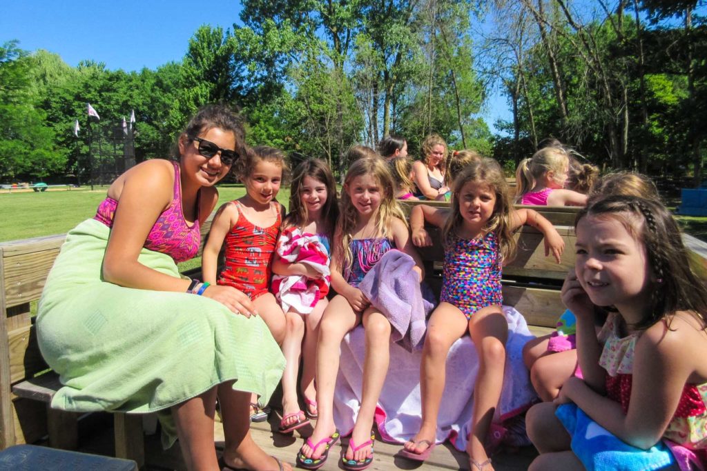 A group of campers and a counselor drying off at the junior lake