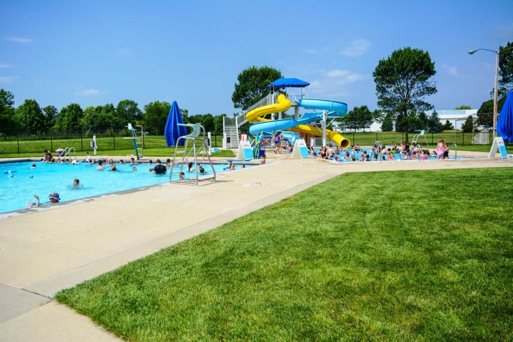 a busy pool day at the pool complex