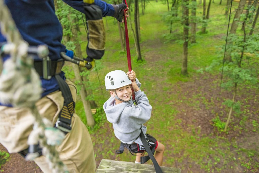 A camper on the ropes course