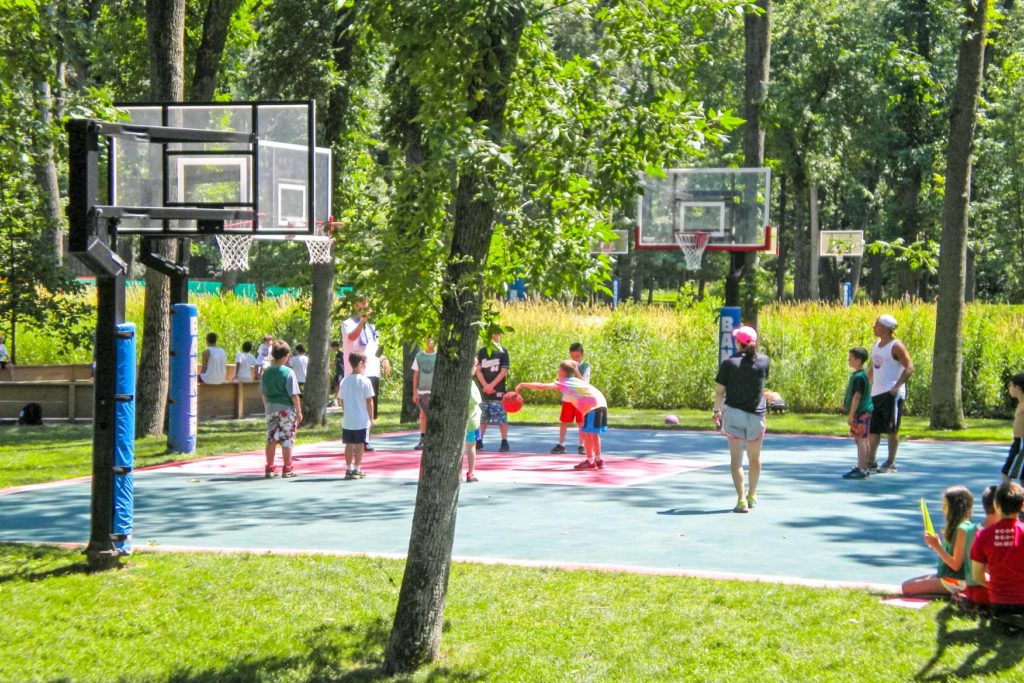 a group of campers playing basketball