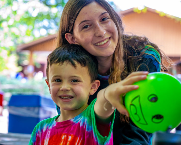 Male camper with female counselor