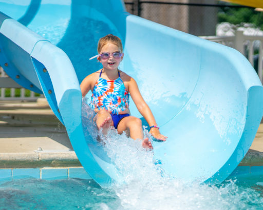 Female camper on waterslide