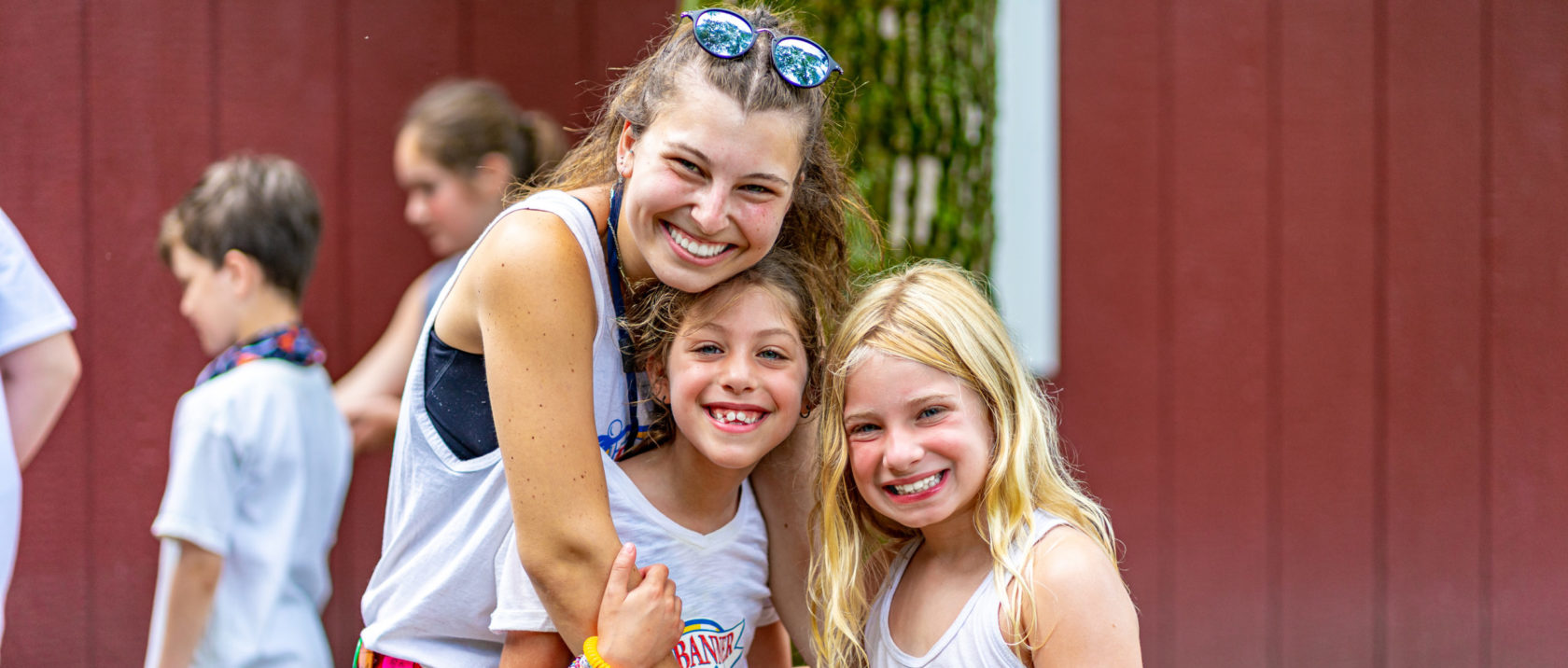 Female counselor spends time with two female campers